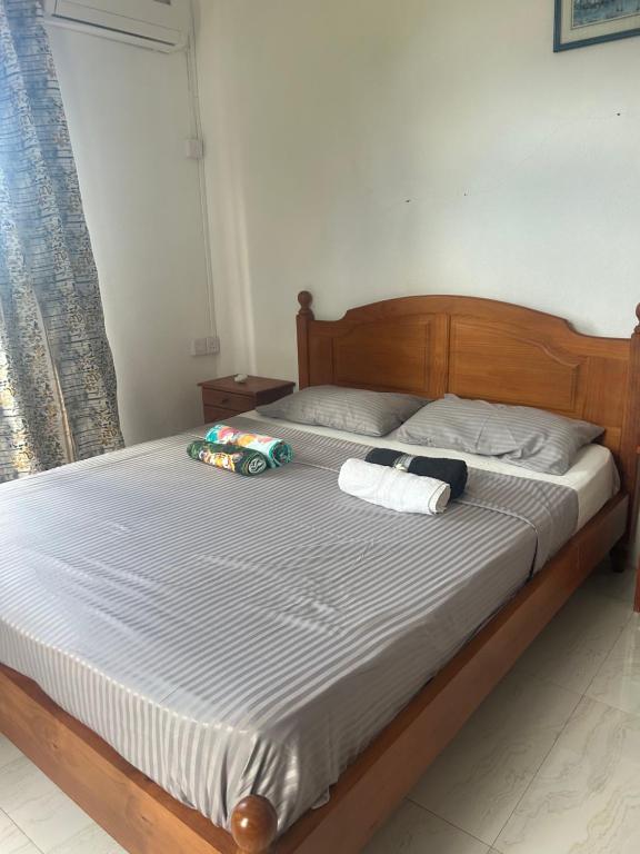 Postel nebo postele na pokoji v ubytování Skipper Dan Bungalow