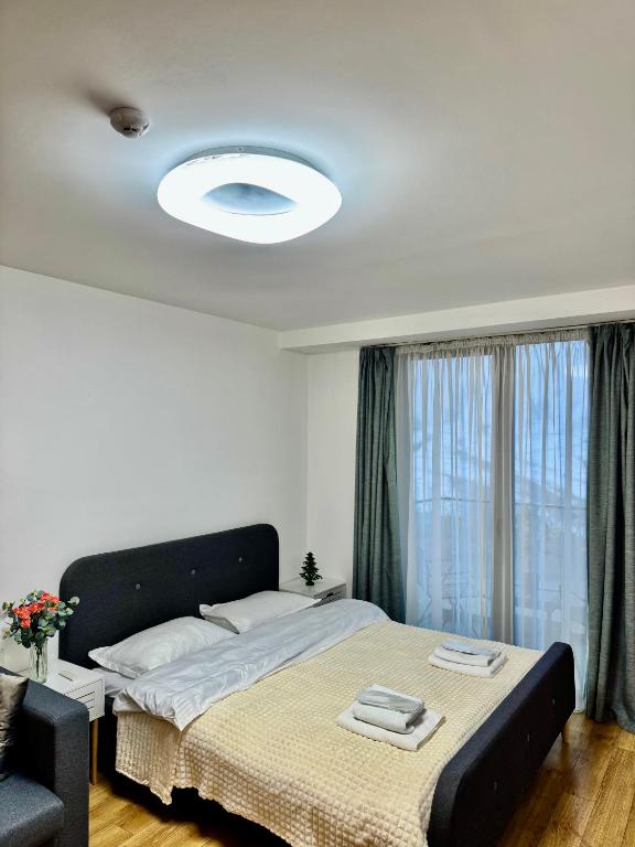 Postel nebo postele na pokoji v ubytování New Gudauri Loft 2 #226
