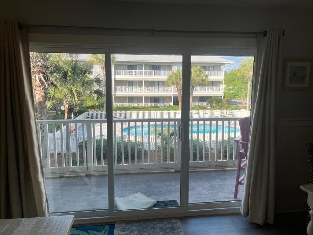 an open window with a view of a balcony at VitaminSeaGrove in Santa Rosa Beach