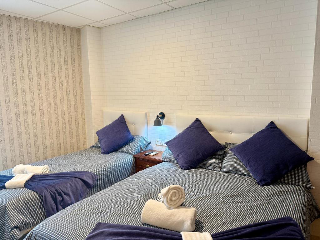 Postel nebo postele na pokoji v ubytování Hotel Sancho