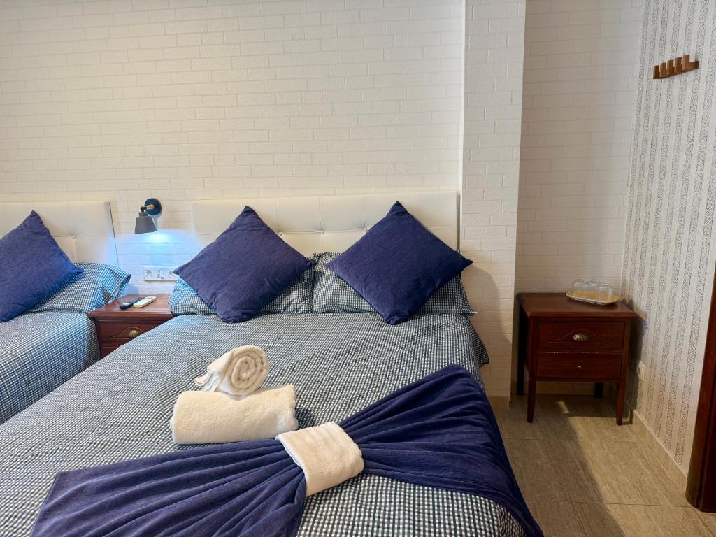 Postel nebo postele na pokoji v ubytování Hotel Sancho