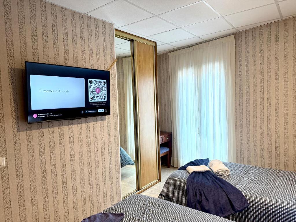 Postel nebo postele na pokoji v ubytování Hotel Sancho