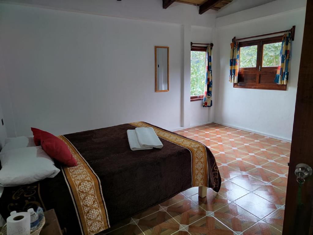Postel nebo postele na pokoji v ubytování Hotel Coyopolan