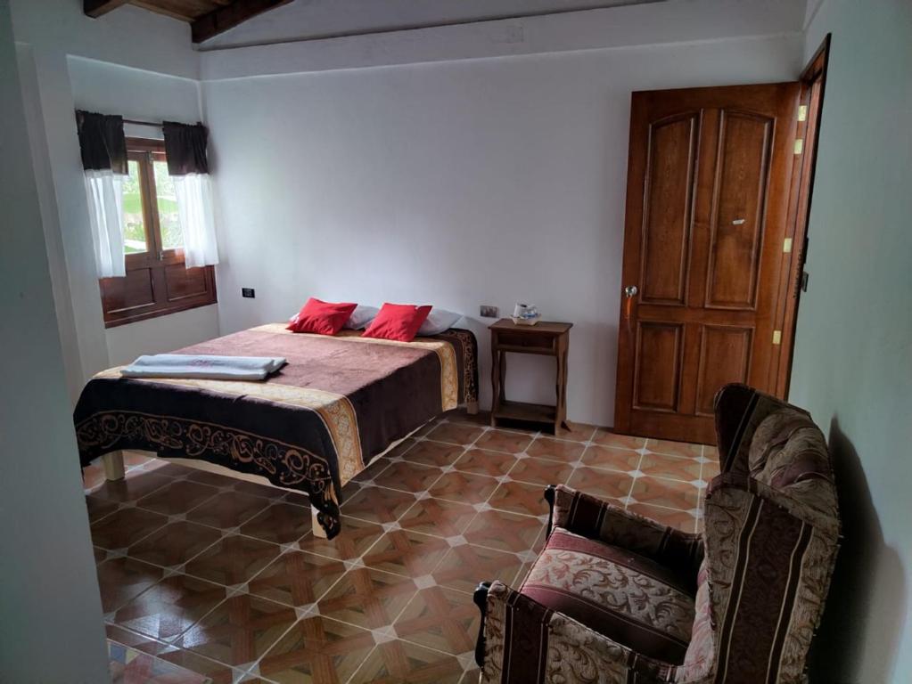 Postel nebo postele na pokoji v ubytování Hotel Coyopolan