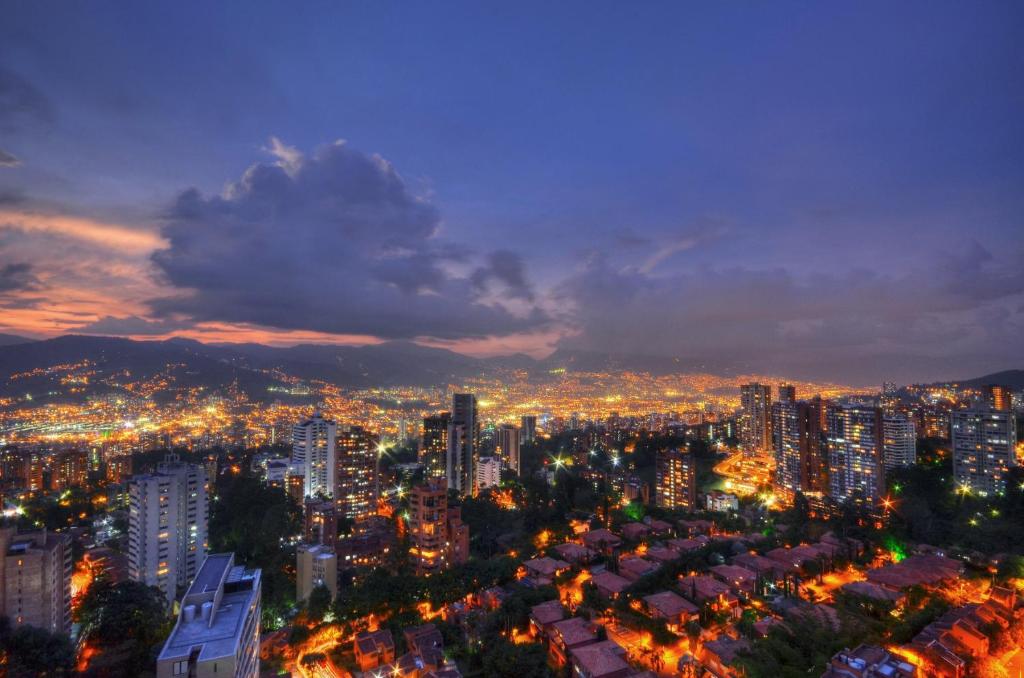 a view of a city at night at The Charlee Hotel in Medellín