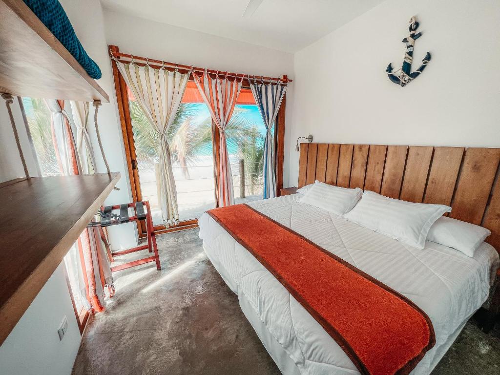 Postel nebo postele na pokoji v ubytování Mi Playa Galapagos Beachfront