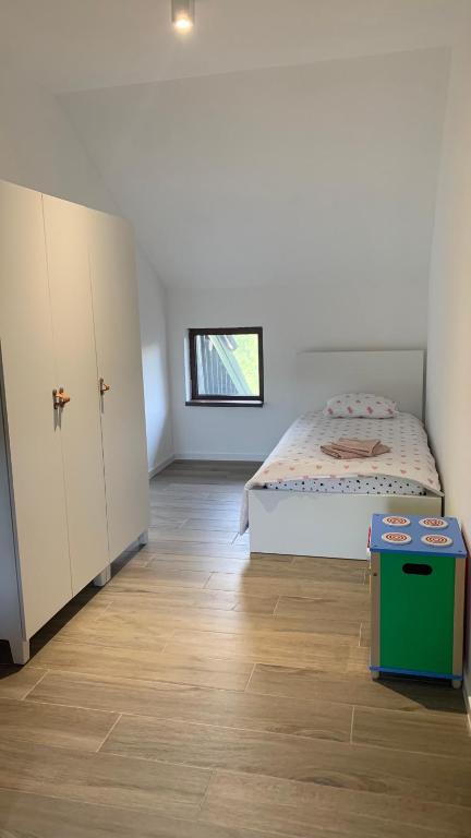 En eller flere senger på et rom på Apartman Veverko