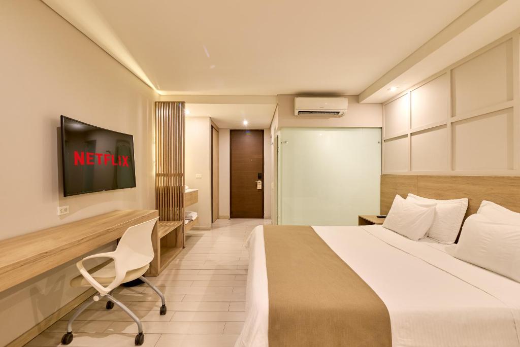 Postel nebo postele na pokoji v ubytování Hotel Dix