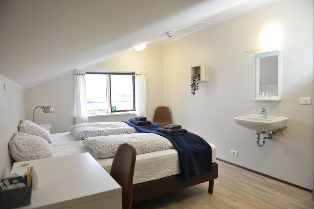 Rúm í herbergi á Klausturhof Guesthouse