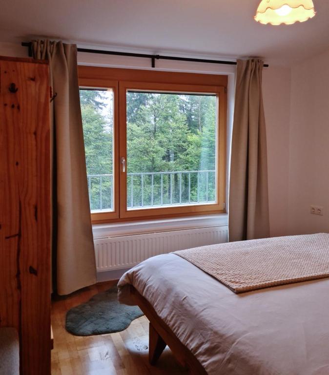 Postel nebo postele na pokoji v ubytování APARTMA JEREBIKA ŠT. 20
