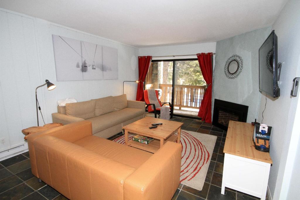 a living room with a couch and a table at Summit 285 1 bedroom 1 bathroom - Pet Friendly in Mammoth Lakes