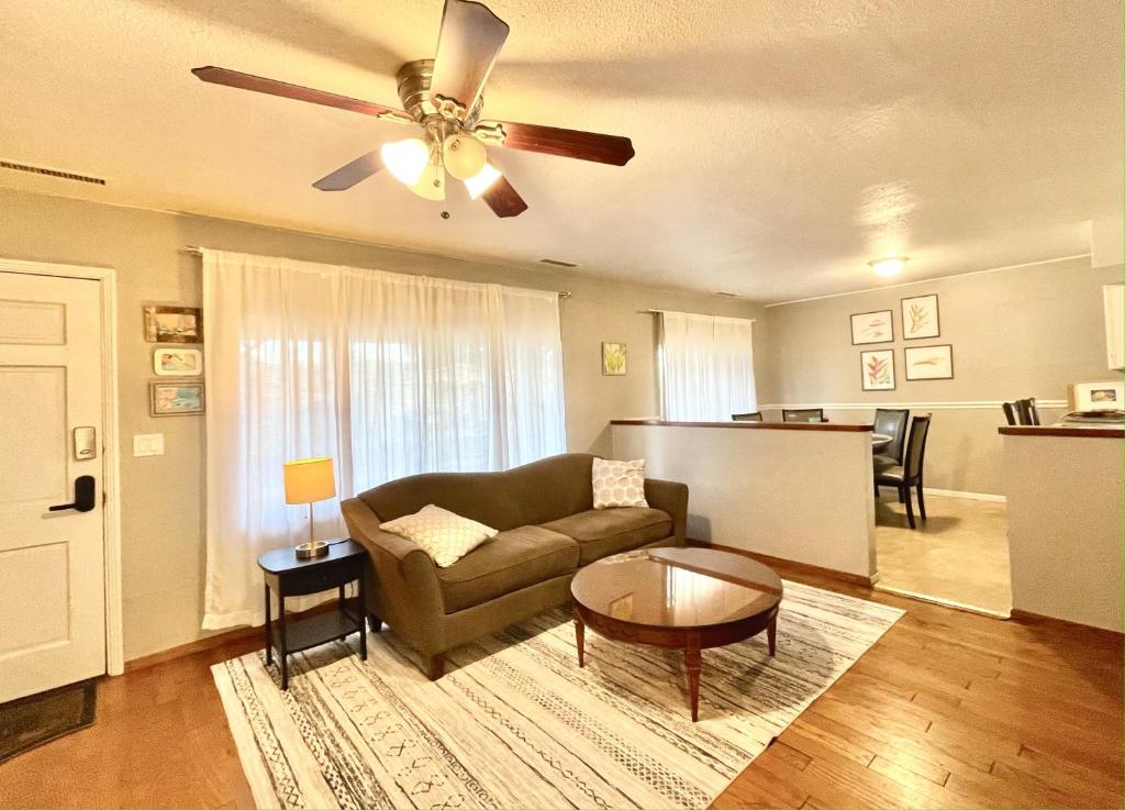 a living room with a couch and a table at Homestead Haven in Concord