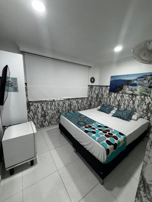 Postel nebo postele na pokoji v ubytování Casa Hotel Manco Mora