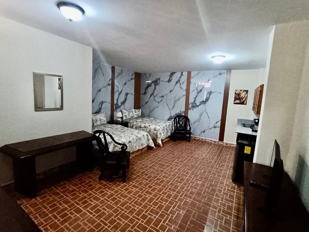 Postel nebo postele na pokoji v ubytování Hostal habitación habitaciones full equipadas a solo 10 minutos del aeropuerto Panamá pasifico a 20 minutos de la ciudad centros comerciales y lugares turísticos playa a 5 minutos