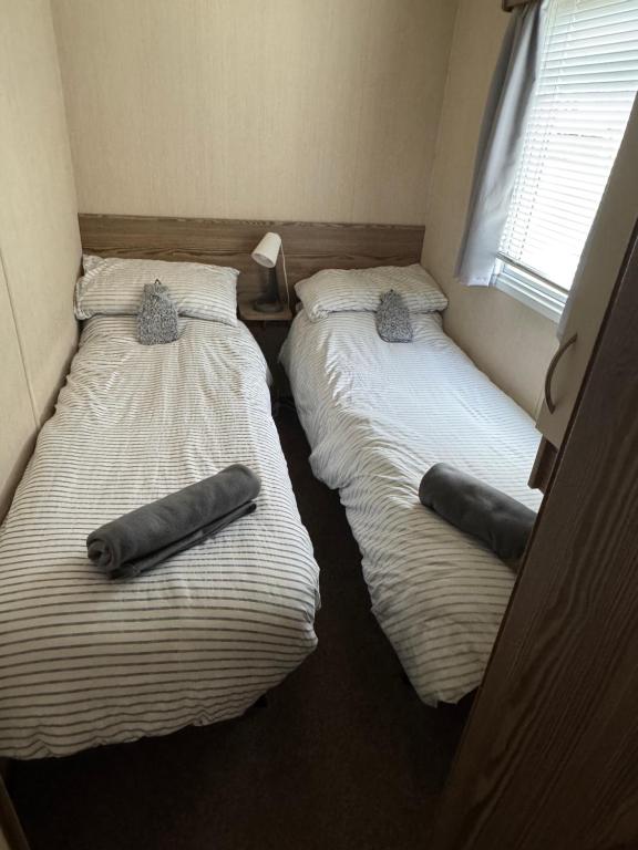 Postel nebo postele na pokoji v ubytování Eevee Sands