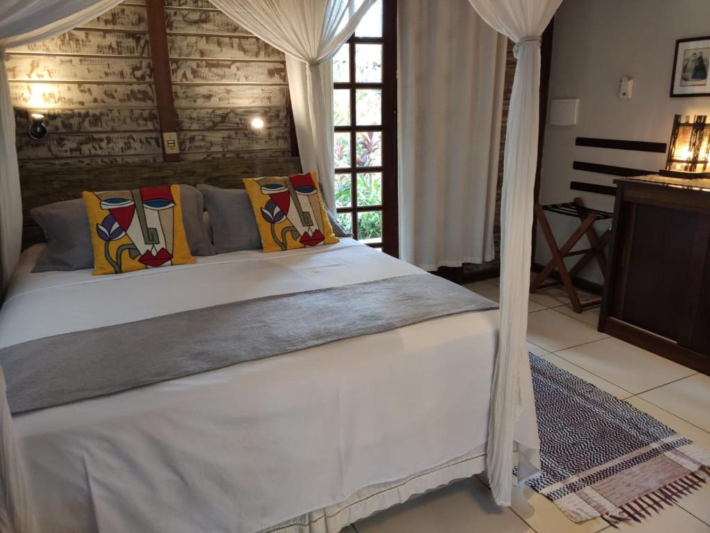 Postel nebo postele na pokoji v ubytování Eliconial Paraty Pousada