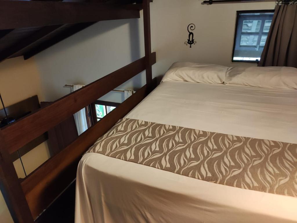 Postel nebo postele na pokoji v ubytování Eliconial Paraty Pousada