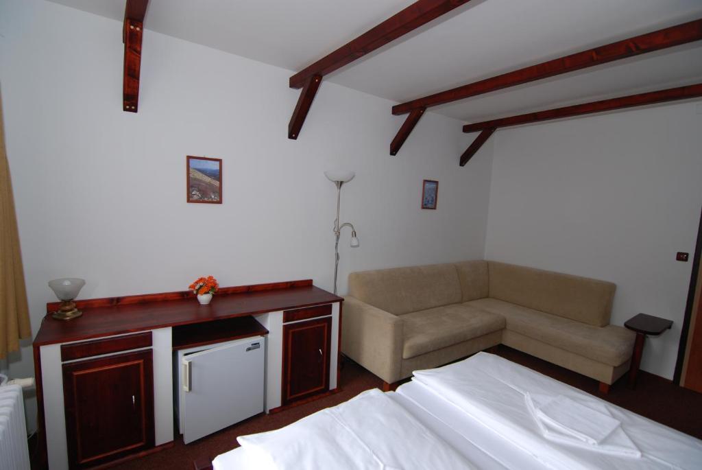 Postel nebo postele na pokoji v ubytování Rodinný "Hotel U Můstků"