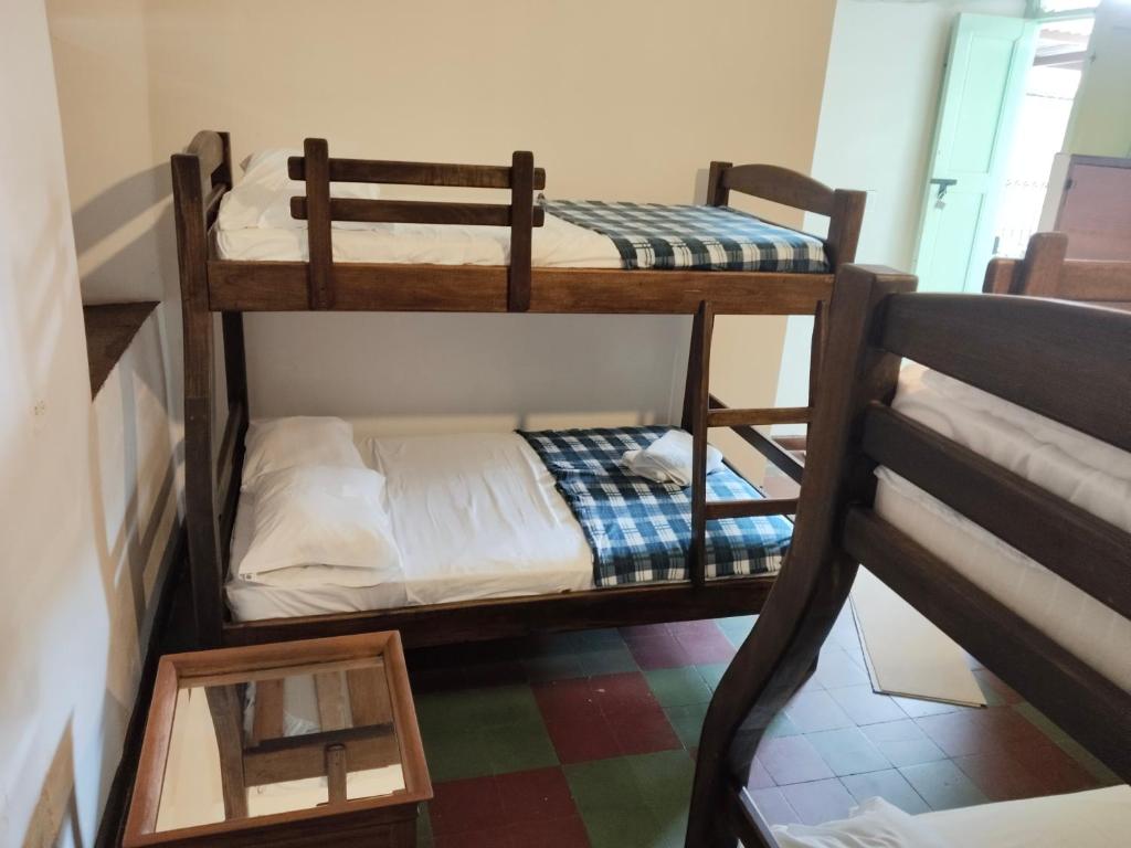 Postel nebo postele na pokoji v ubytování Sandalio Hostal Cali