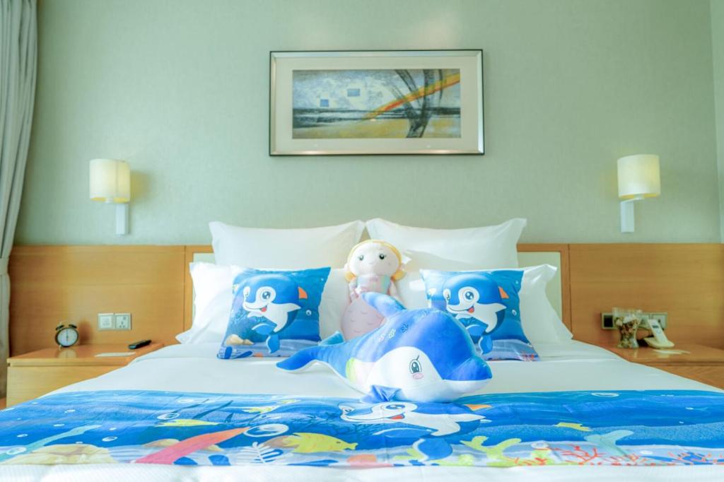 Postel nebo postele na pokoji v ubytování Residence G Nanshan