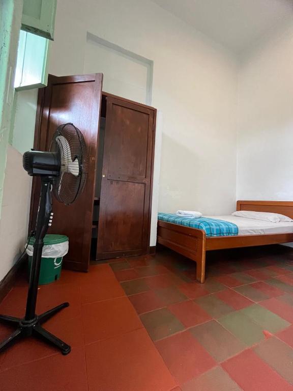 Postel nebo postele na pokoji v ubytování Sandalio Hostal Cali
