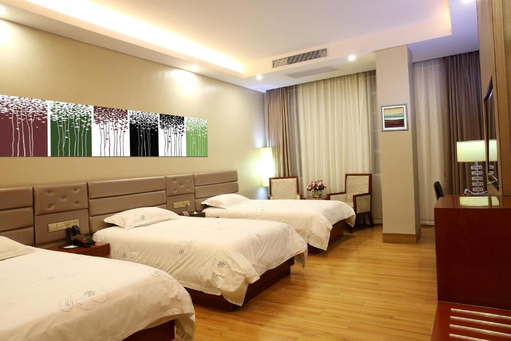 Postel nebo postele na pokoji v ubytování Iron Travel Hotel