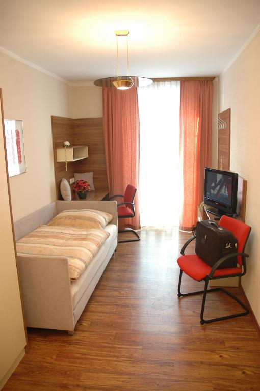 Posteľ alebo postele v izbe v ubytovaní Hotel Garni Daniela Urich