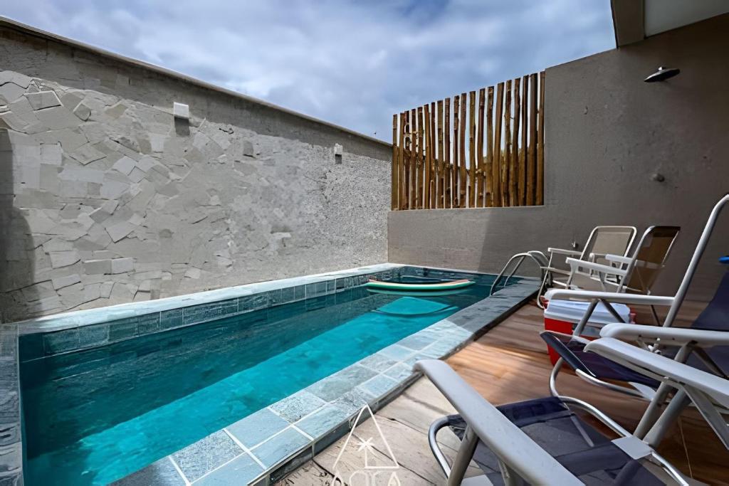 Bazén v ubytování Duplex Completo na Praia de Tatuamunha com Piscina nebo v jeho okolí