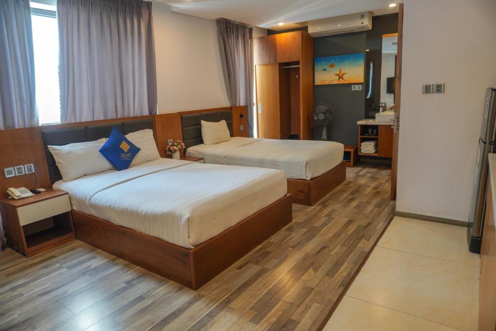 Postel nebo postele na pokoji v ubytování Jolia Hotel Danang Beach