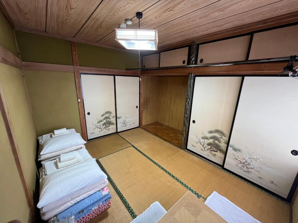 Postel nebo postele na pokoji v ubytování ふる里 Mt Fuji Inn Furusato
