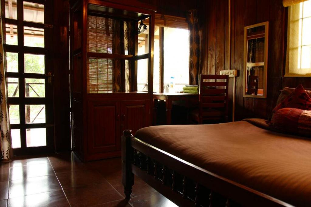 Ένα ή περισσότερα κρεβάτια σε δωμάτιο στο Jungle Retreat Wayanad