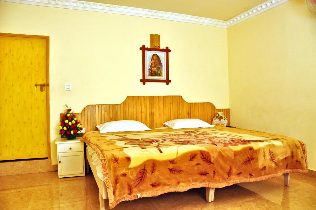 Postel nebo postele na pokoji v ubytování Bellavista Resort Munnar