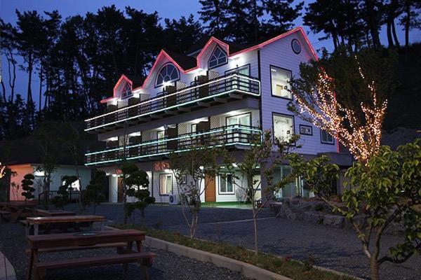 a large building with a bench in front of it at Blue Heights in Boryeong