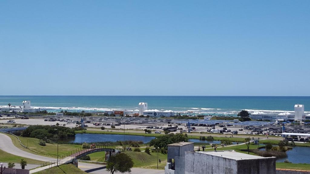 a view of a city with the ocean in the background at Apart Hotel Santa Lucia in Mar del Plata
