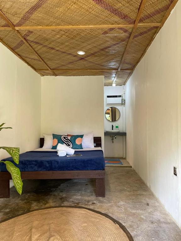 Postel nebo postele na pokoji v ubytování Dawn Patrol Siargao