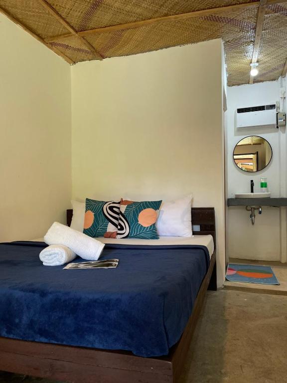 Postel nebo postele na pokoji v ubytování Dawn Patrol Siargao