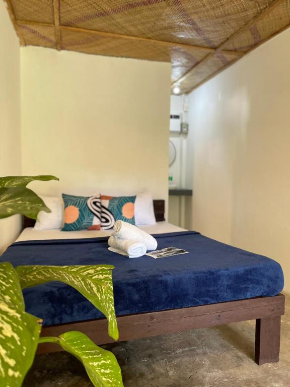 Postel nebo postele na pokoji v ubytování Dawn Patrol Siargao
