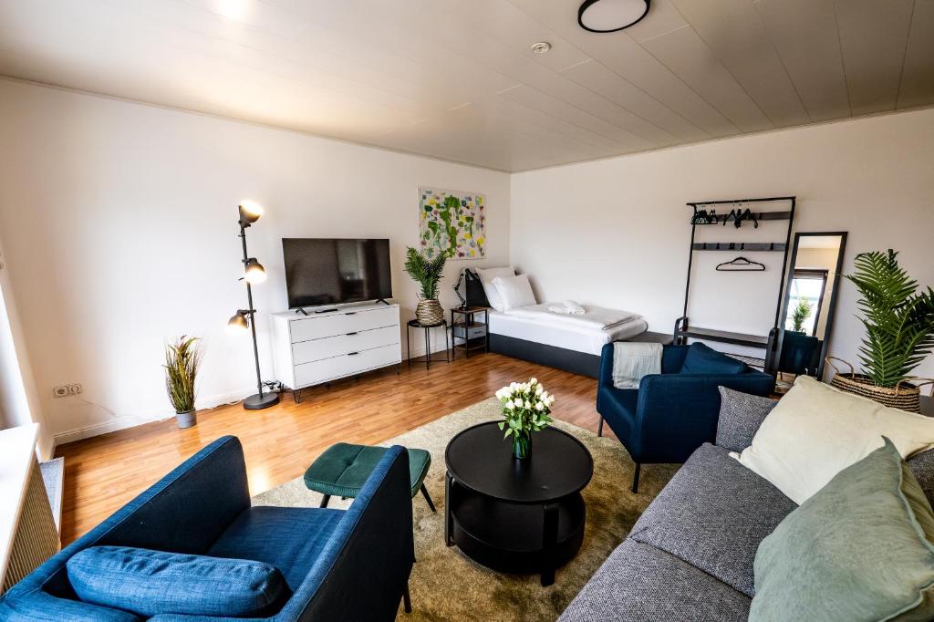 Χώρος καθιστικού στο 6 Zimmer Haus mit Wintergarten 2 Bäder Industrienah sehr ruhig gelegen