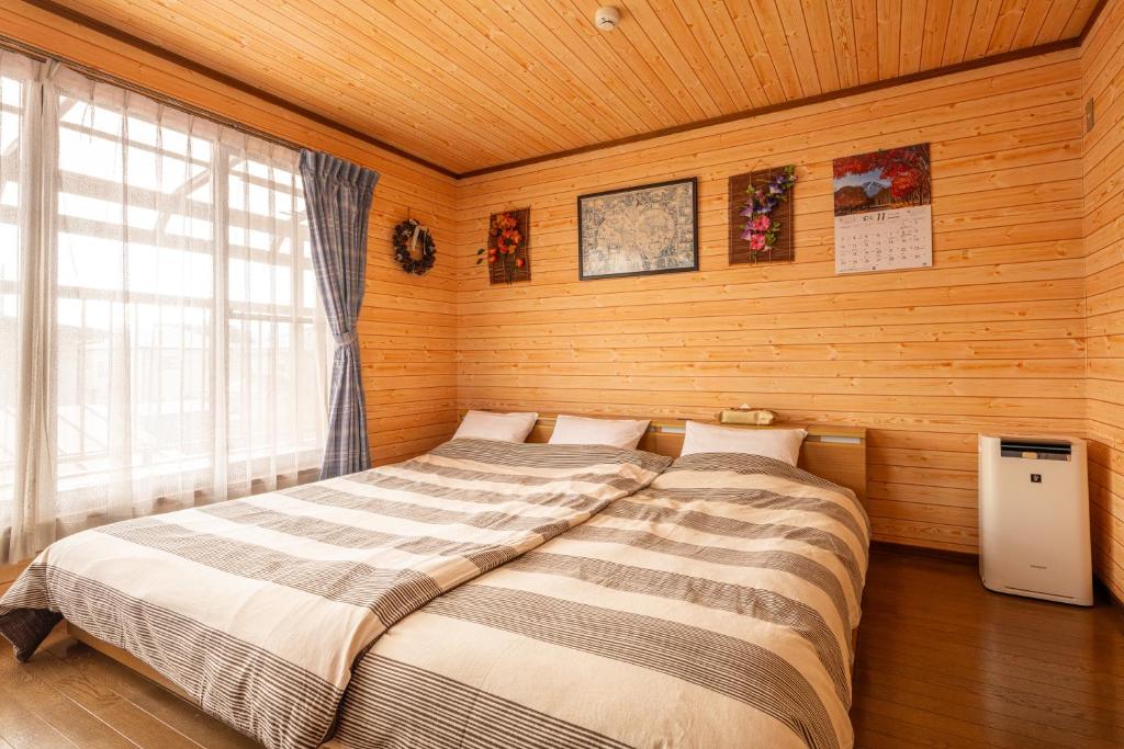 Postel nebo postele na pokoji v ubytování Asahi