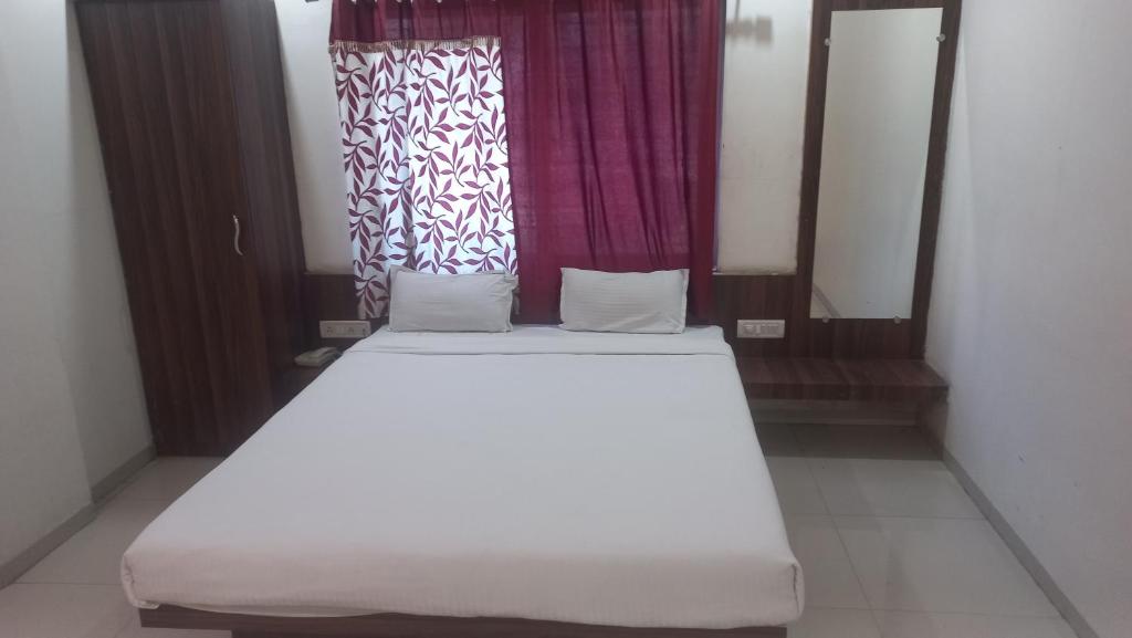 Postel nebo postele na pokoji v ubytování Hotel Namrata