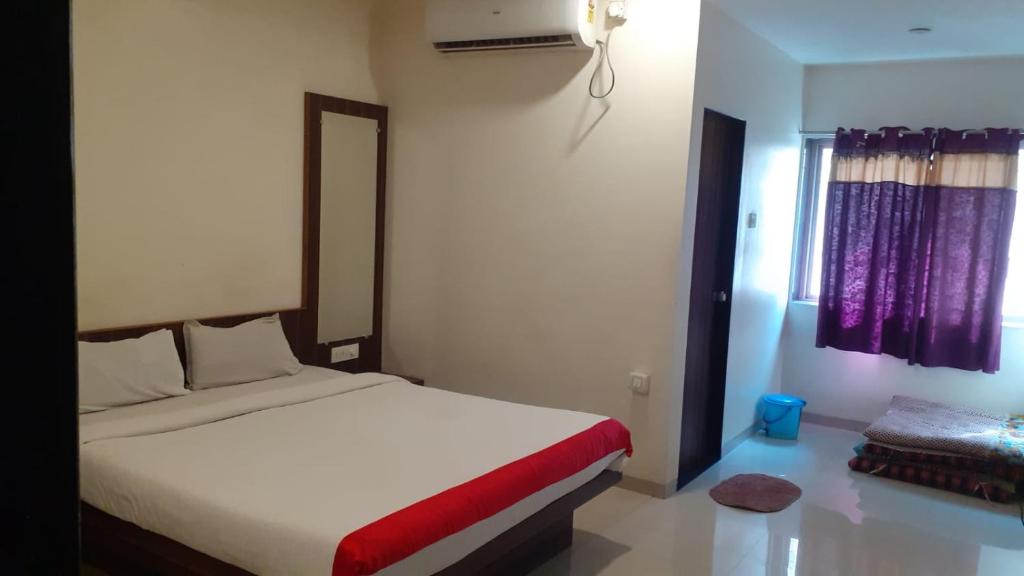 Postel nebo postele na pokoji v ubytování Hotel Namrata