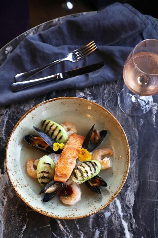 a plate of food with seafood on a table at DoubleTree by Hilton Hotel Newcastle International Airport in Newcastle upon Tyne