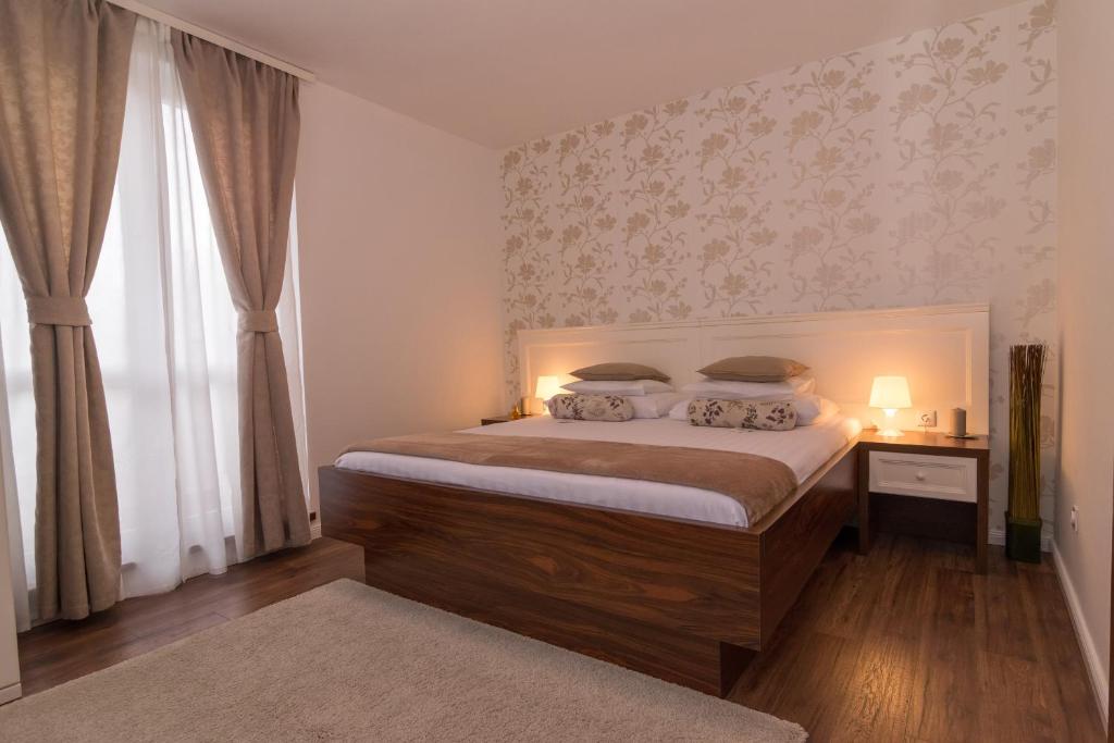 Łóżko lub łóżka w pokoju w obiekcie Apartment Arsenal 1