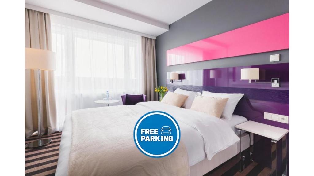 Posteľ alebo postele v izbe v ubytovaní METROPOL Hotel Katowice