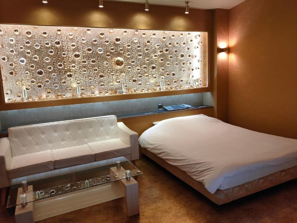 Postel nebo postele na pokoji v ubytování アネックス艶 -大人専用-