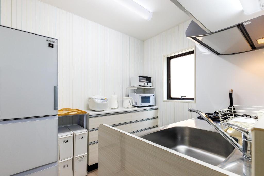 Kuchyň nebo kuchyňský kout v ubytování 一棟貸し完全プライベートビーチ6分 KOEI Farm lodge