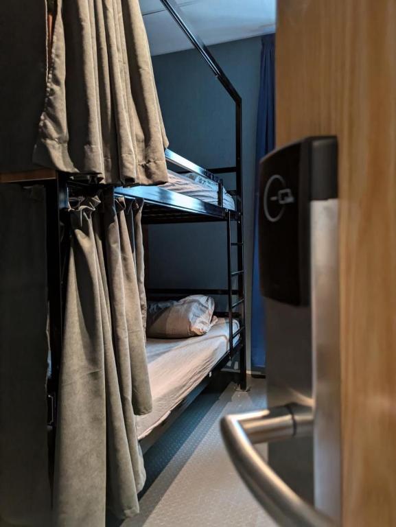 Postel nebo postele na pokoji v ubytování Bla Bla Hostel