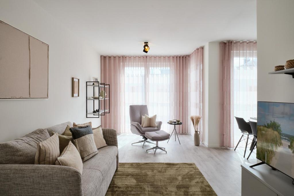 Un lugar para sentarse en Apartment C9 mit überdachtem Balkon & Nutzung der Wellness- & Aktivbereiche im "Pine Hill Resort"