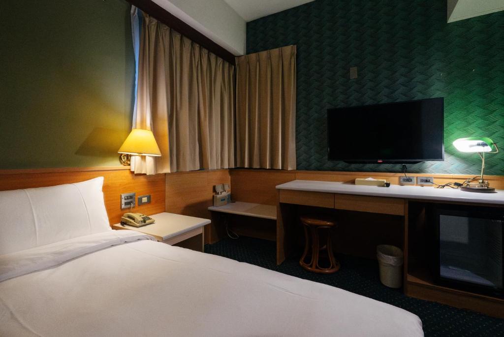 Postel nebo postele na pokoji v ubytování 天津大酒店 Vagus Hotel