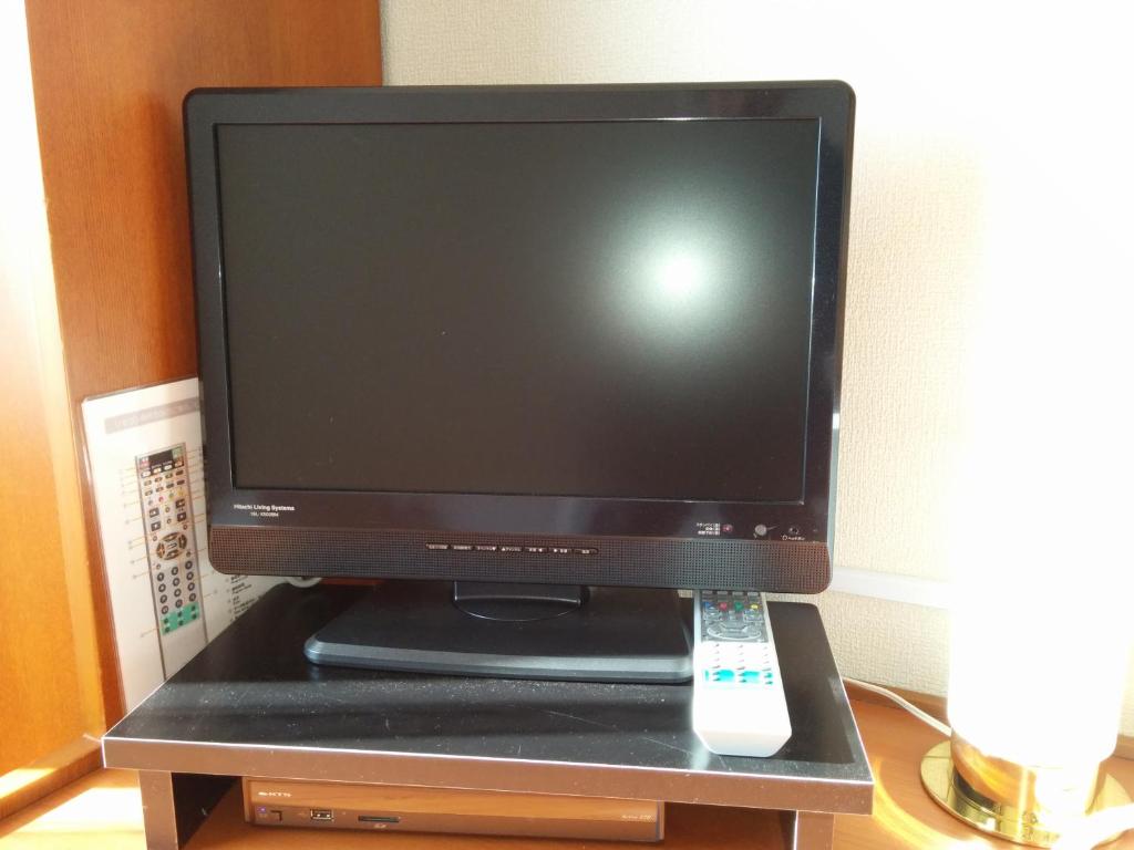 ホテルクニミ御殿場にあるテレビまたはエンターテインメントセンター